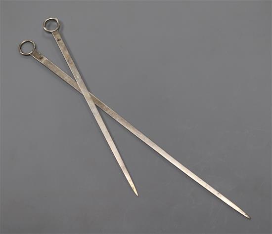Two late 18th/early 19th century white metal skewers, both with makers mark only IH below a pellet, 24.8cm & 17.5cm.